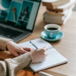 woman proofreading an article on paper