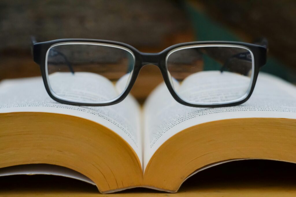 Eyeglasses resting on an open book
